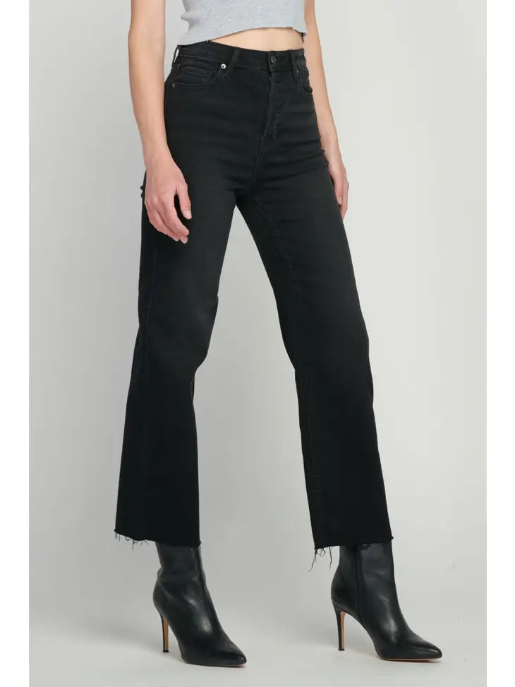 image of a black jean. Model facing to the left