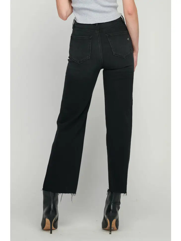 image of a black jean. Model facing to the back