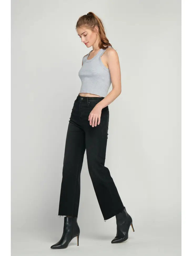 full image of a black jean. Model facing to the left